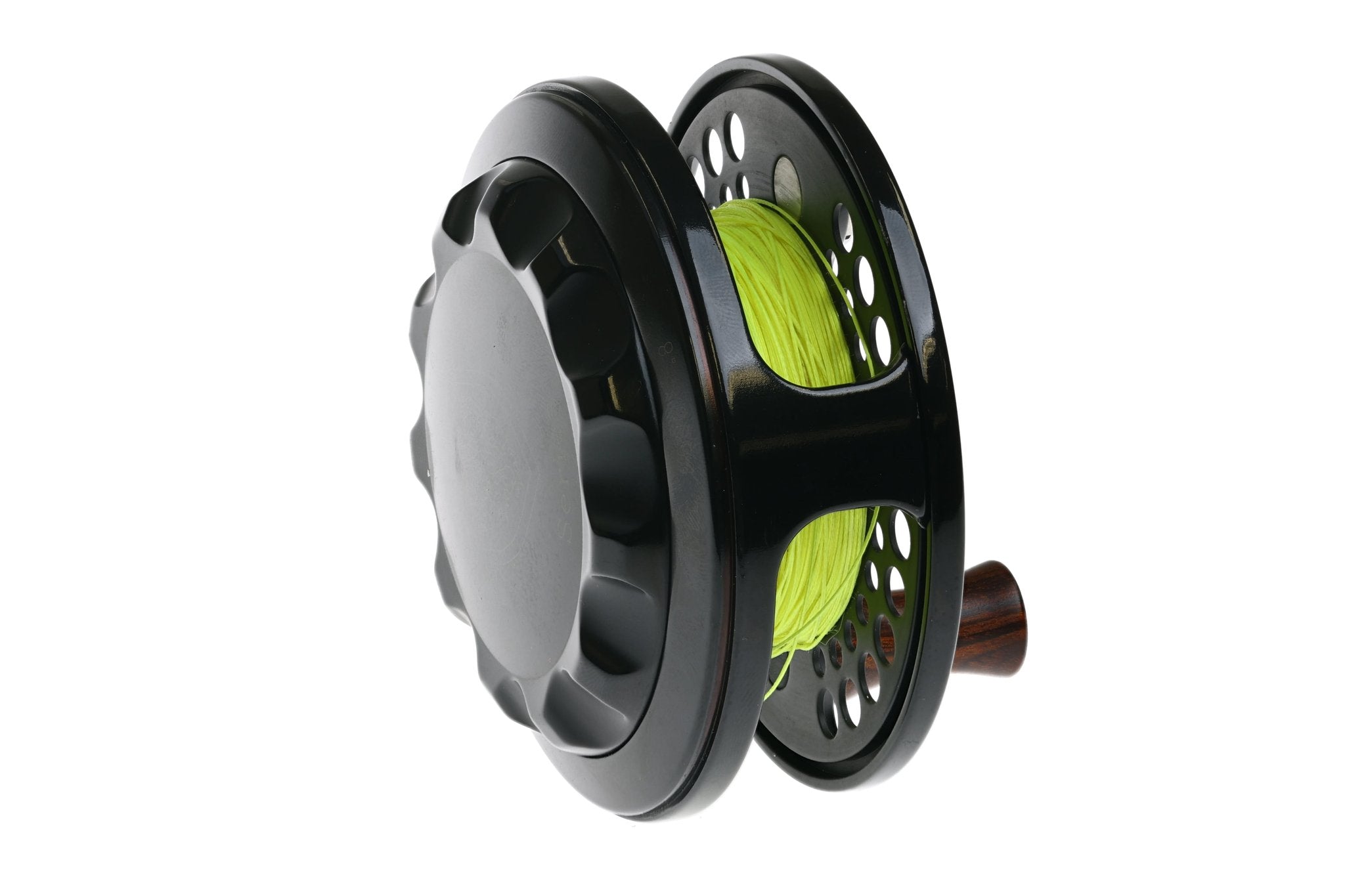 Black gloss metal fly reel with perforated spool, neon chartreuse line and wooden knob, classic Charlton 8500 reel style