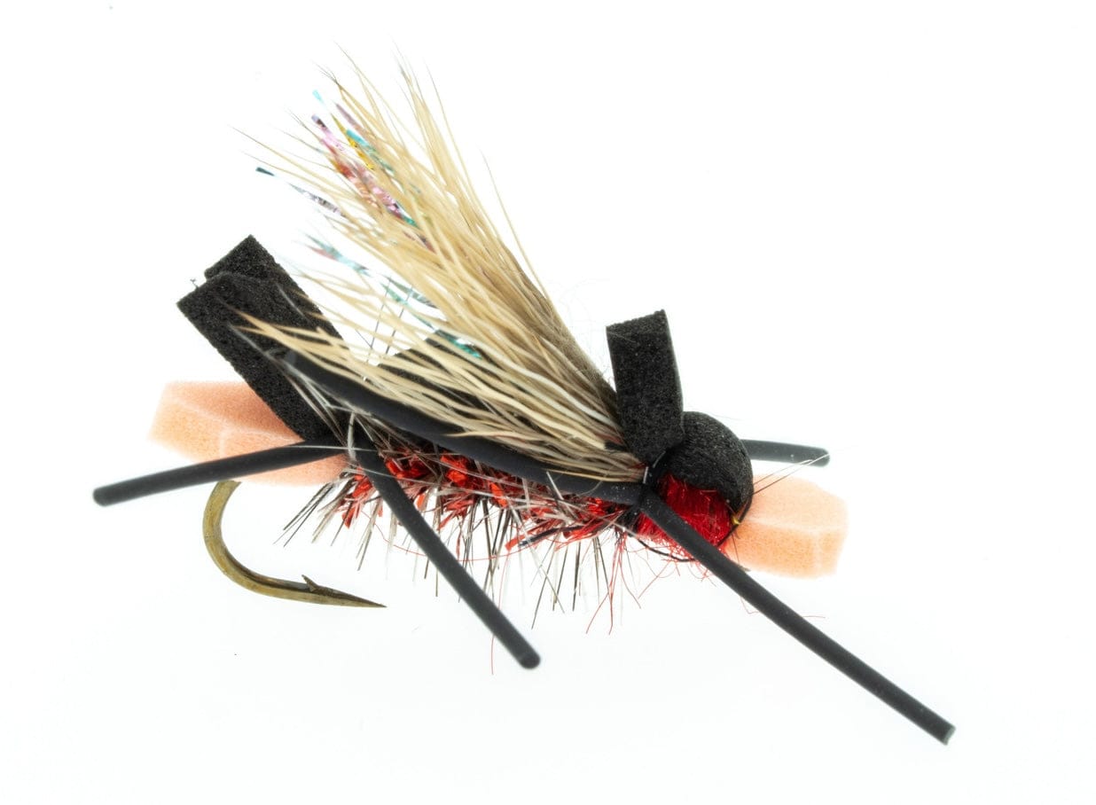 Umpqua Amys Ant dry fly with black foam body, red dubbed thorax, tan deer-hair wing, black rubber legs