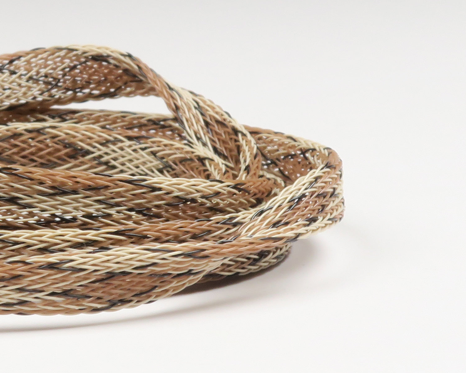 Tan, cream and black braided synthetic body tubing for fly tying, flexible mesh tube by Fish-Skull