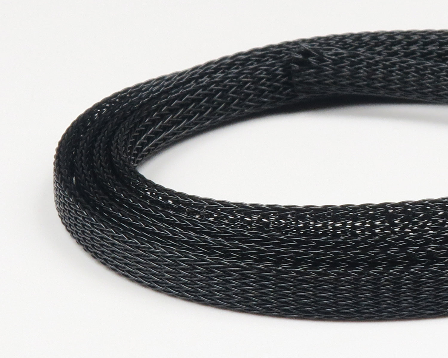 Black braided Fish-Skull body tubing coiled, fine woven tubular mesh material for fly tying