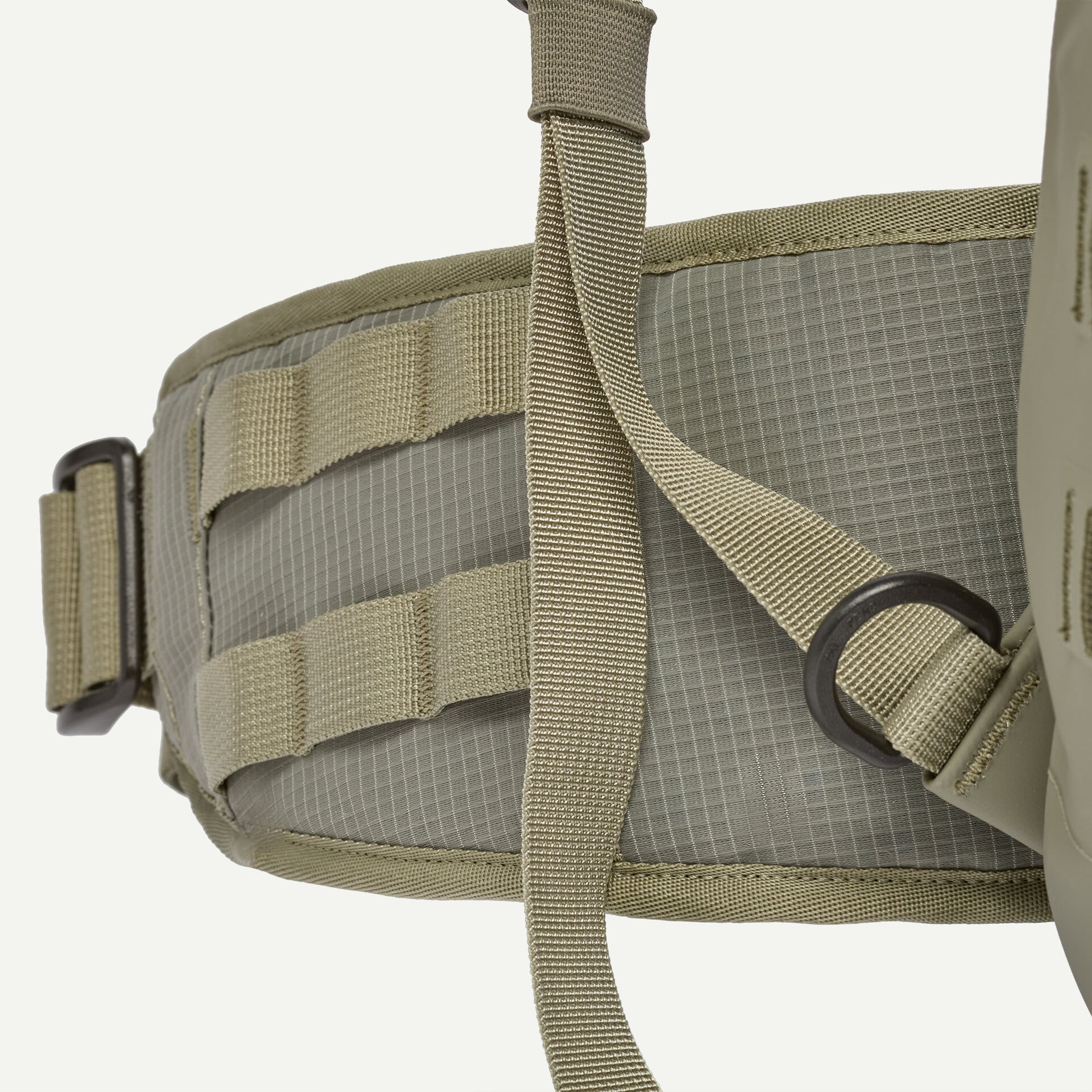 Olive khaki Patagonia roll-top pack hip belt close-up showing ripstop fabric, nylon webbing straps, D-ring and MOLLE loops
