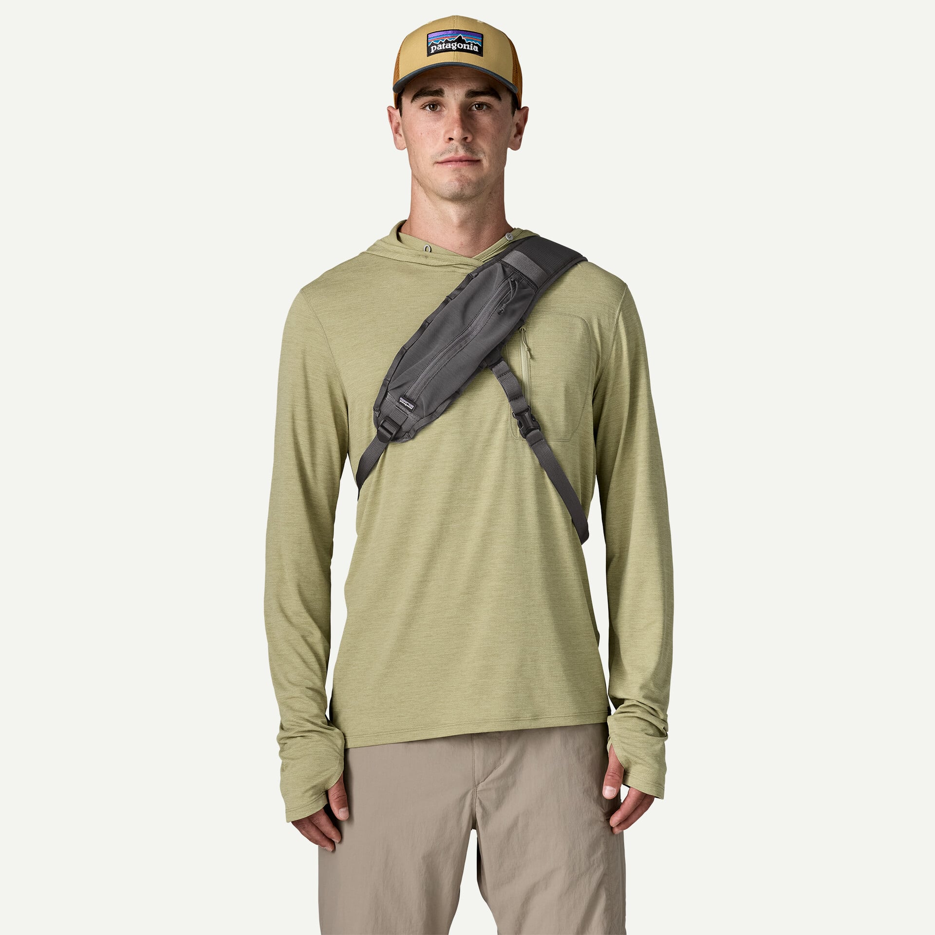 Patagonia Guidewater Switch Pack gray nylon sling pack worn crossbody, slim zippered pocket and padded shoulder strap