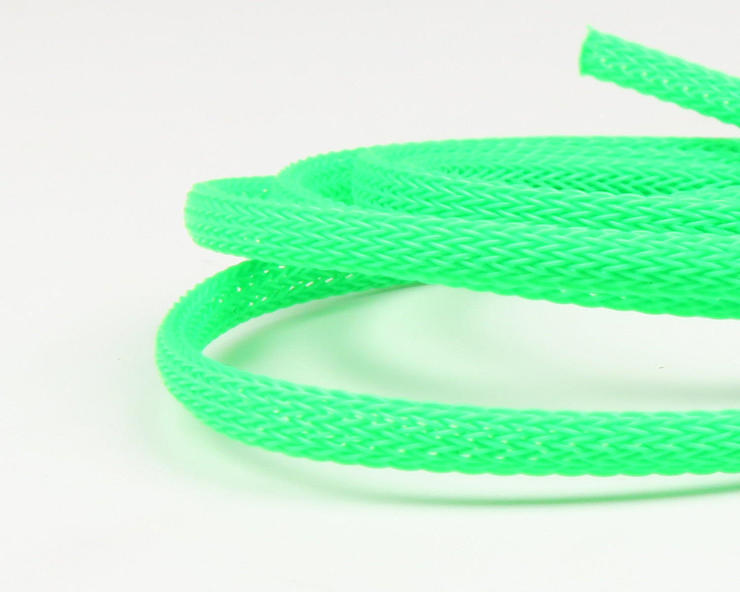 Neon green braided nylon body tubing coil, flexible mesh tubular braid for fly tying