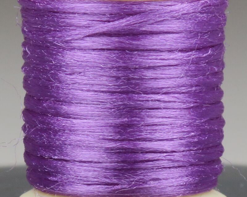 Purple Hareline Antron yarn spool, shiny synthetic fly-tying fiber with silky sheen and fine fuzzy texture