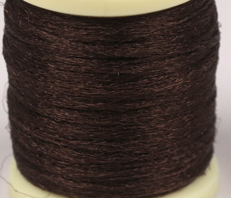 Dark brown Hareline Antron yarn spool with fine shiny synthetic fibers for fly tying