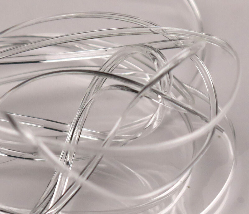 Clear Hareline half-round D-rib coiled translucent plastic fly tying ribbing with glossy D-shaped strands