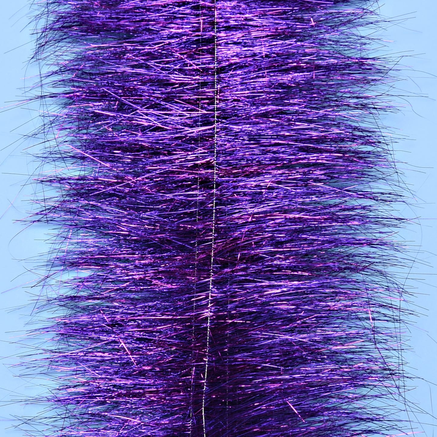 Enrico Puglisi purple sparkle brush with dense metallic tinsel fibers around central core for fly tying