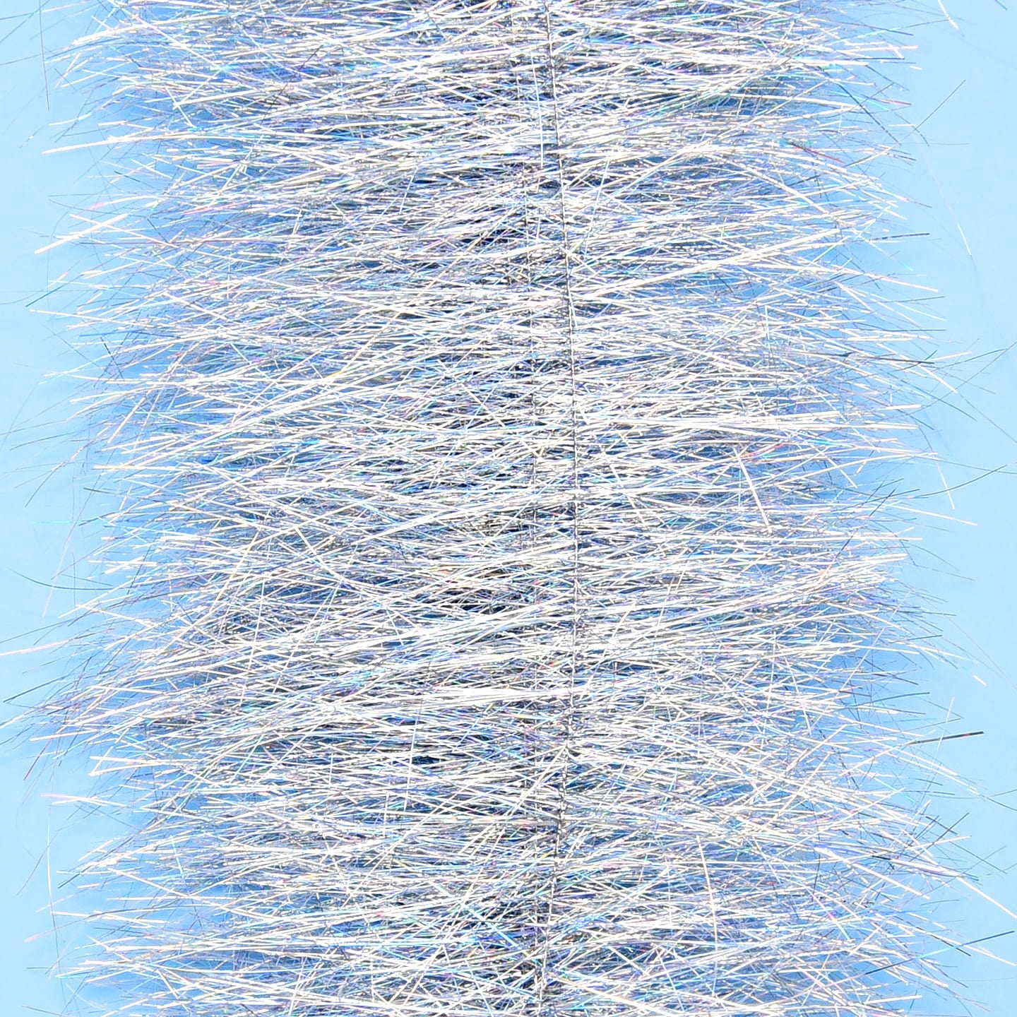 Enrico Puglisi Sparkle Brush silver iridescent tinsel bristles on blue background, fly tying material