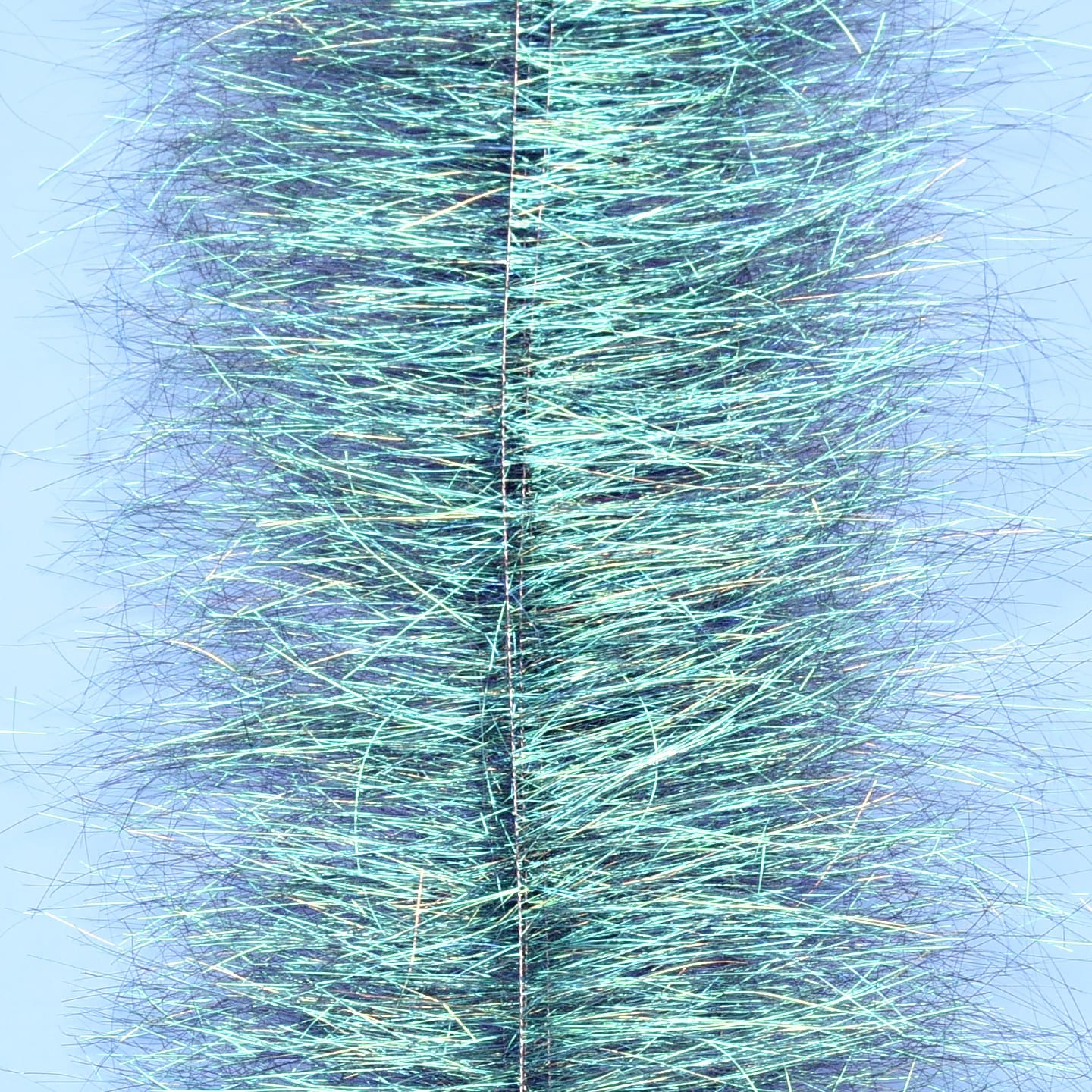 Iridescent teal synthetic fibers densely packed around a central wire, shimmery sparkle brush for fly tying
