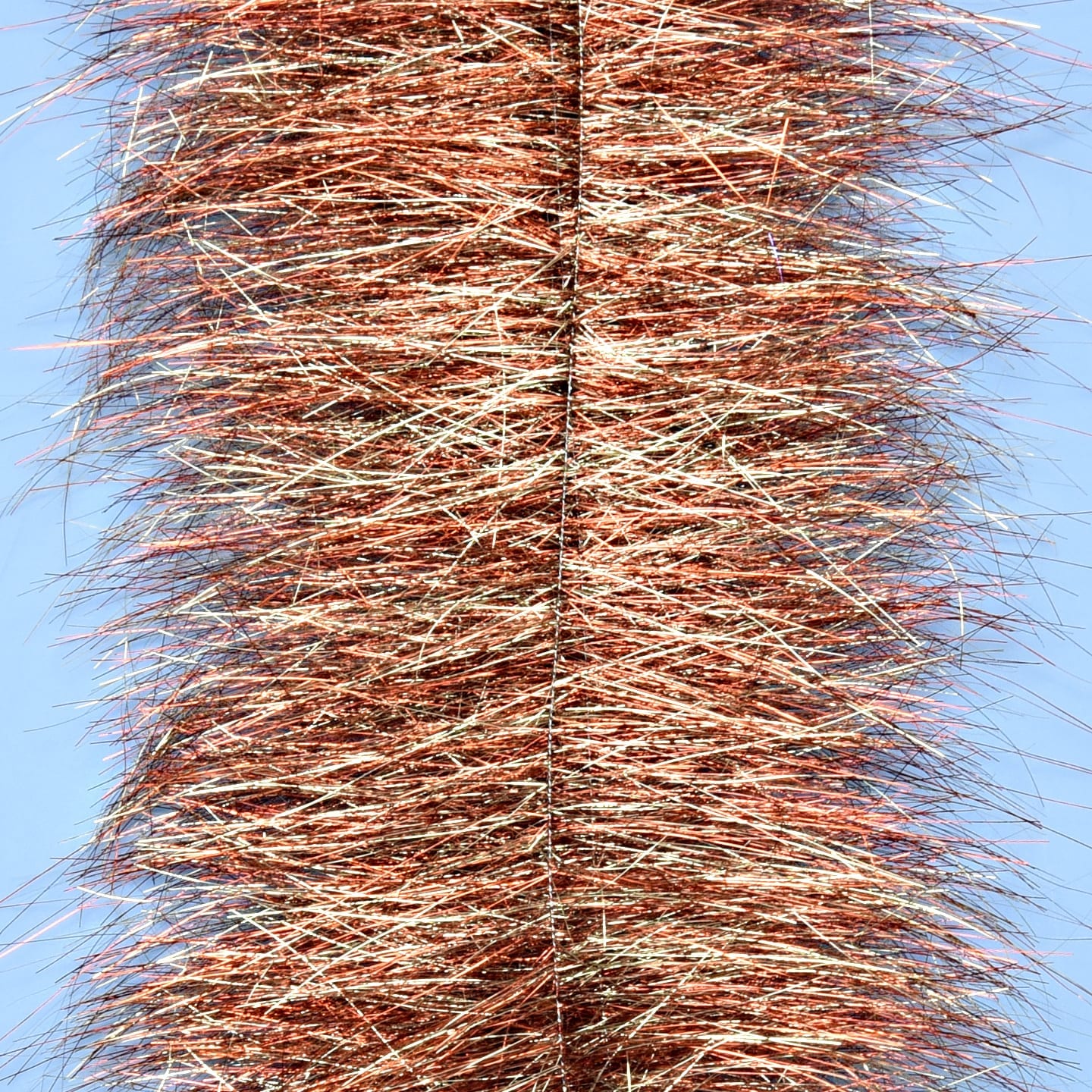 Copper and silver metallic tinsel sparkle brush with dense, long reflective fibers on a twisted wire core for fly tying