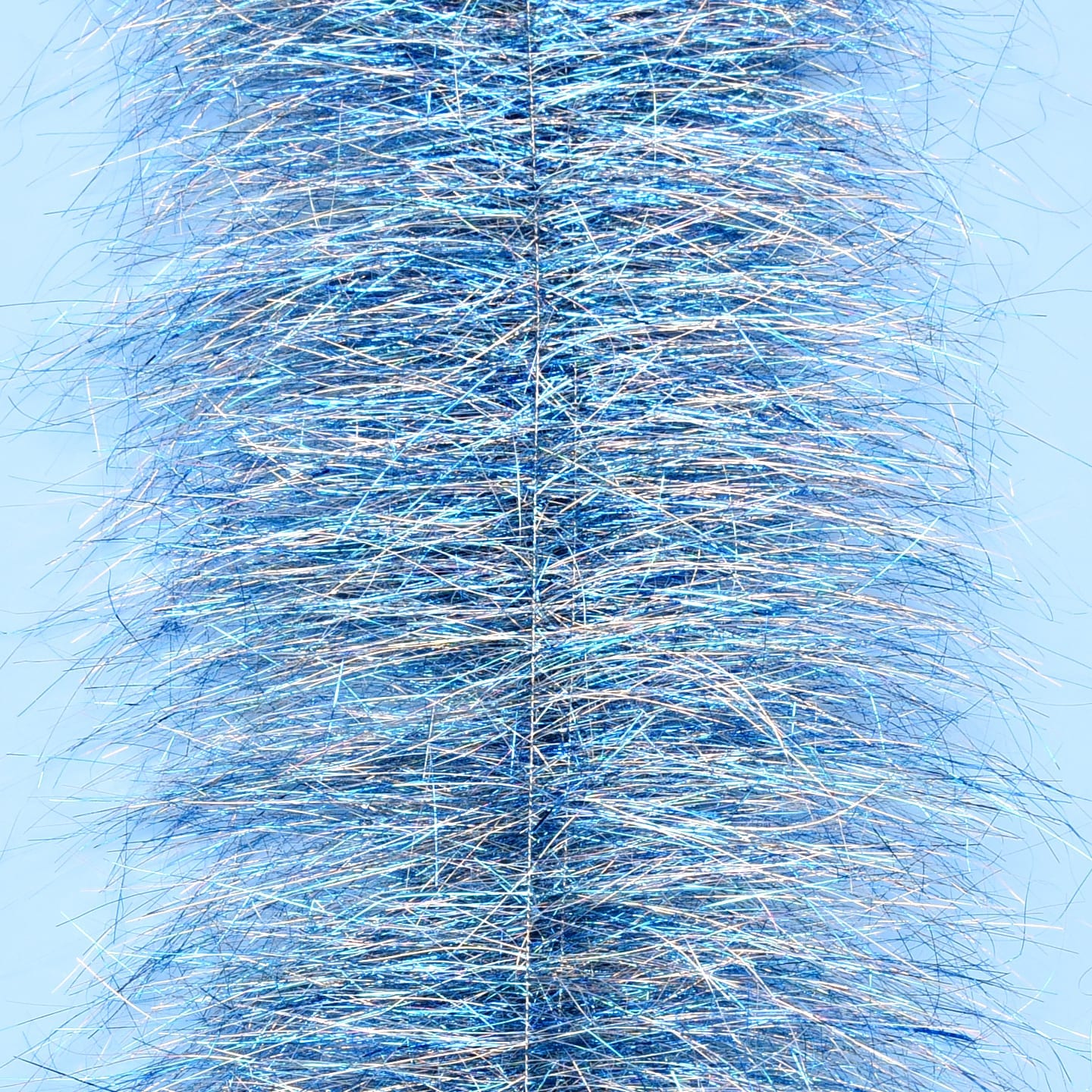 Close-up blue metallic tinsel fibers on dense Enrico Puglisi sparkle brush for fly tying