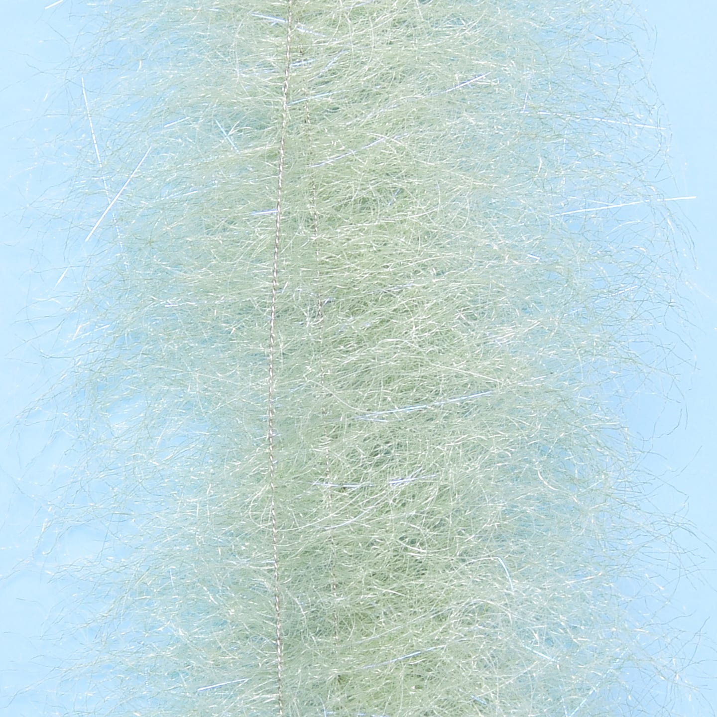 Seafoam green Enrico Puglisi Shrimp Dub Brush with wispy synthetic fibers and silver flash for fly tying