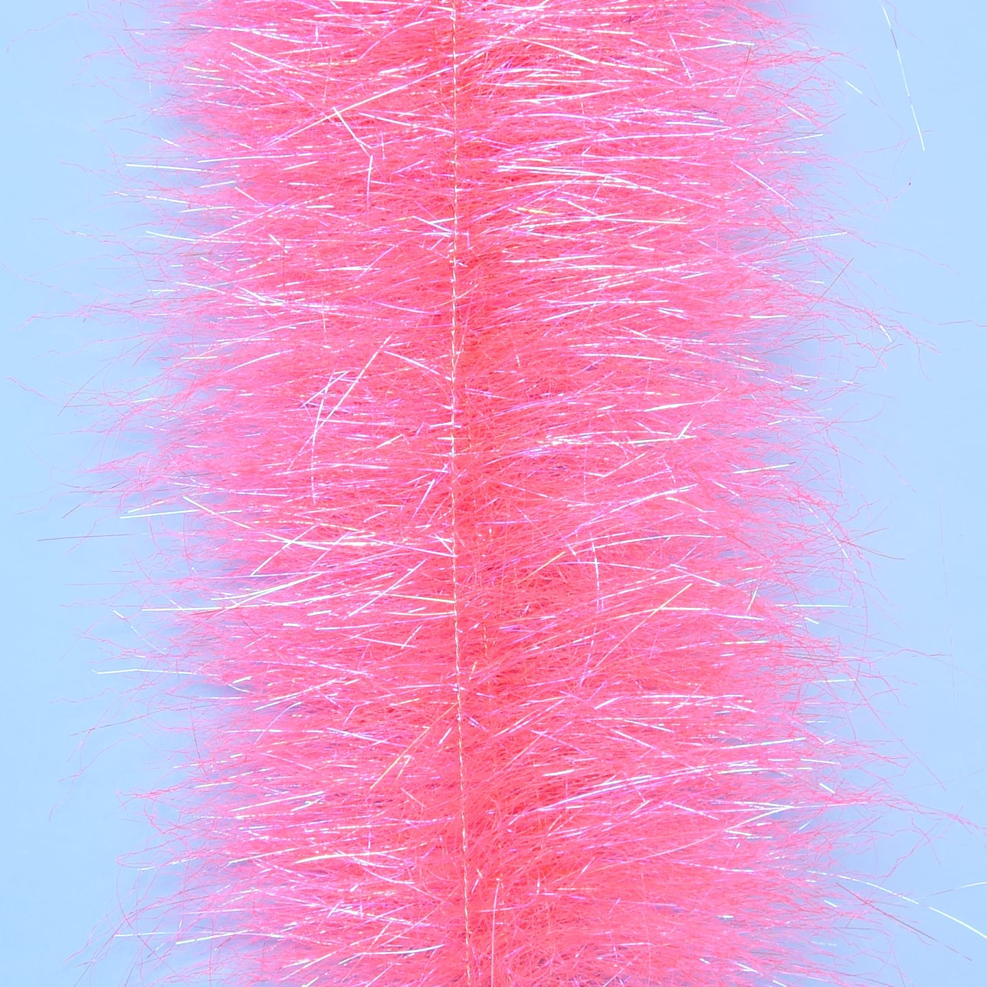 Bright pink Enrico Puglisi Anadromus brush with fuzzy synthetic fibers and iridescent tinsel strands for fly tying