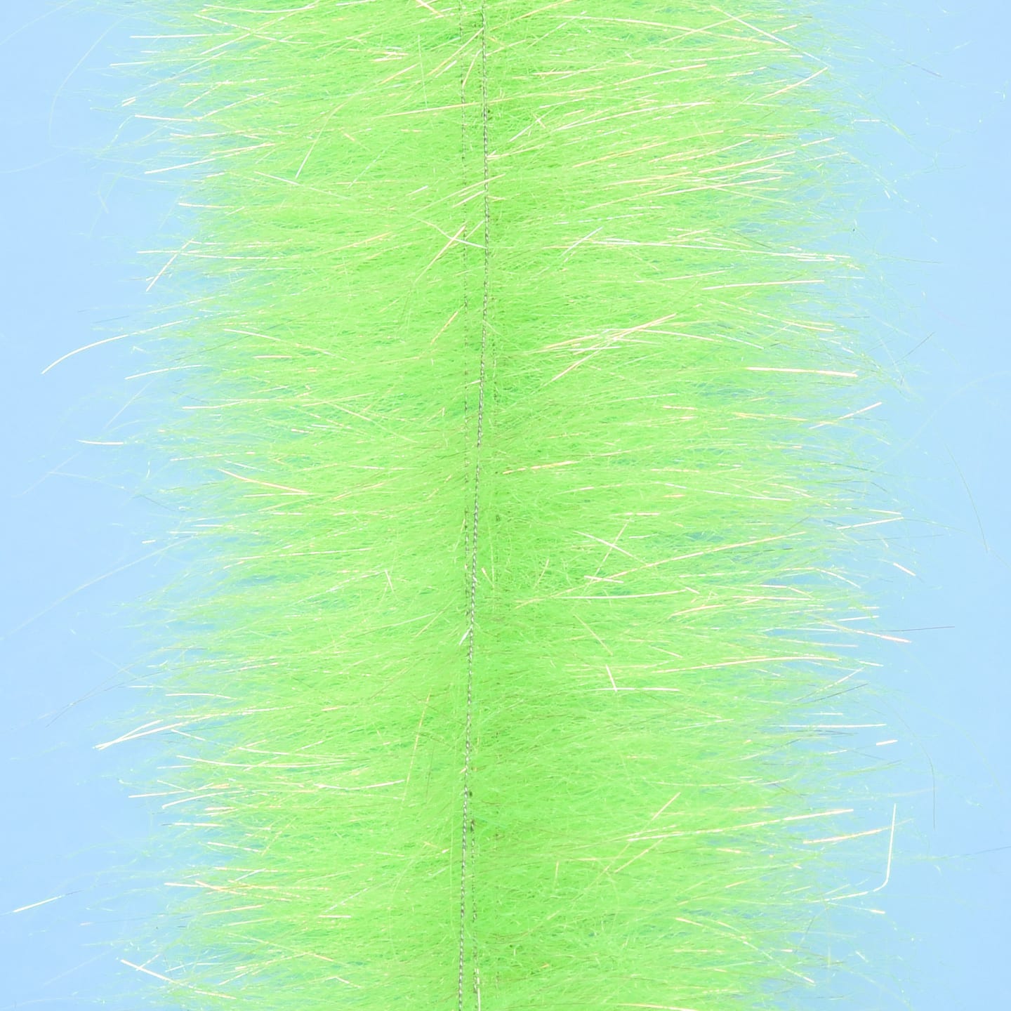 Chartreuse synthetic Anadromus brush strip with central stitched core and iridescent flash fibers for fly tying