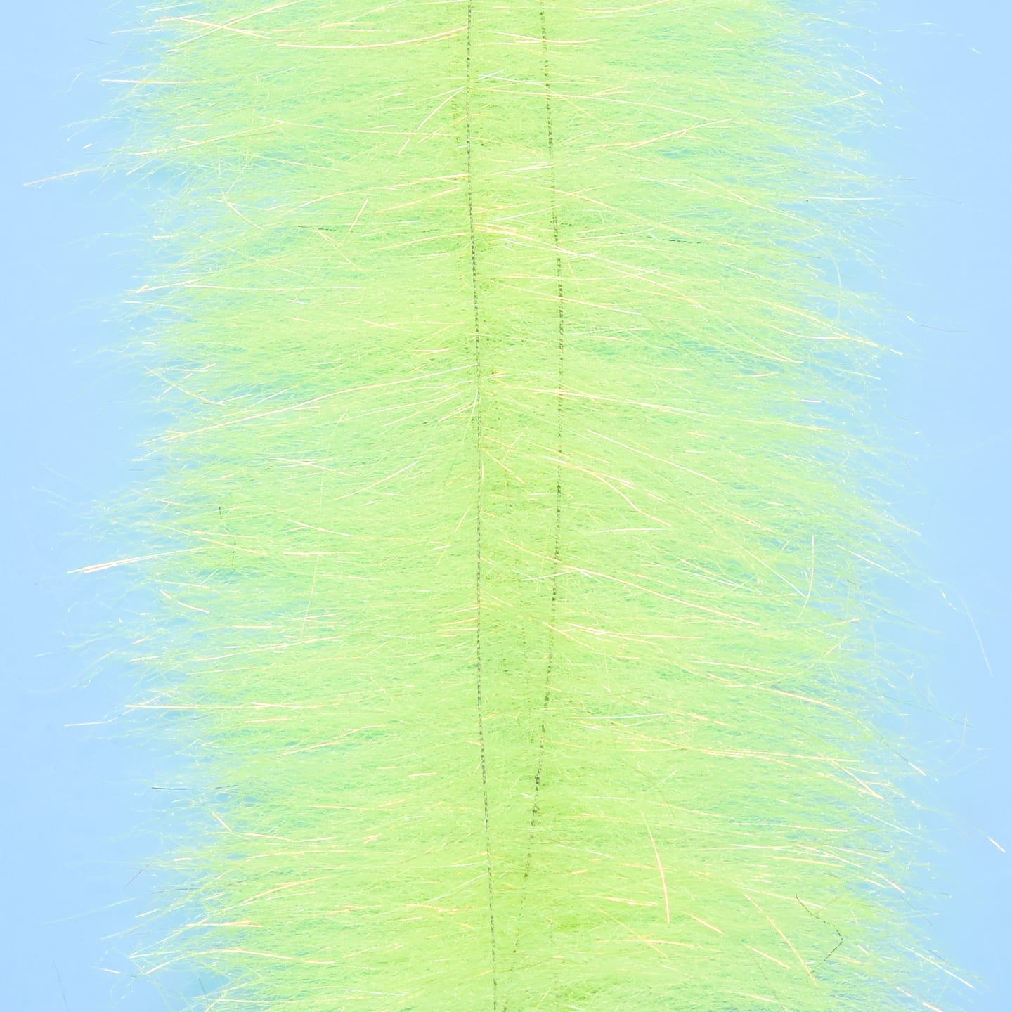 Chartreuse Anadromus brush with dense synthetic fur, iridescent flash fibers and center stitching for fly tying