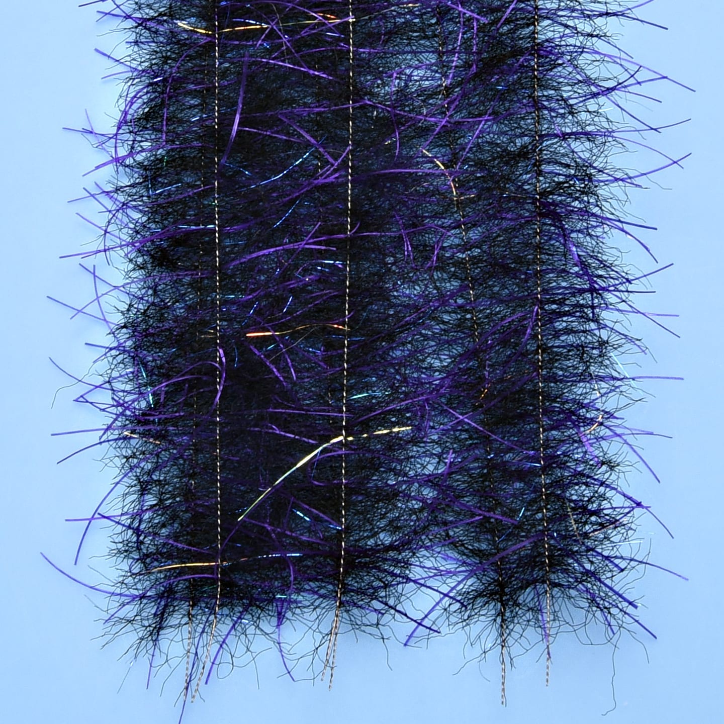 Black tarantula hairy legs brush with purple fibers and iridescent tinsel, stitched channelled synthetic hair for fly tying