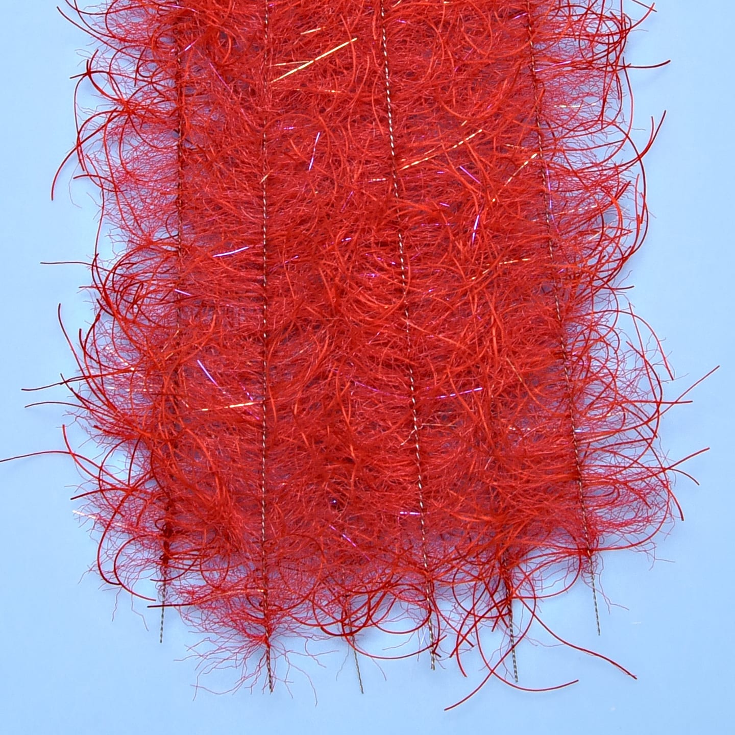 Enrico Puglisi Tarantula red hairy legs brush strip with wispy synthetic fibers and gold tinsel, fly tying material