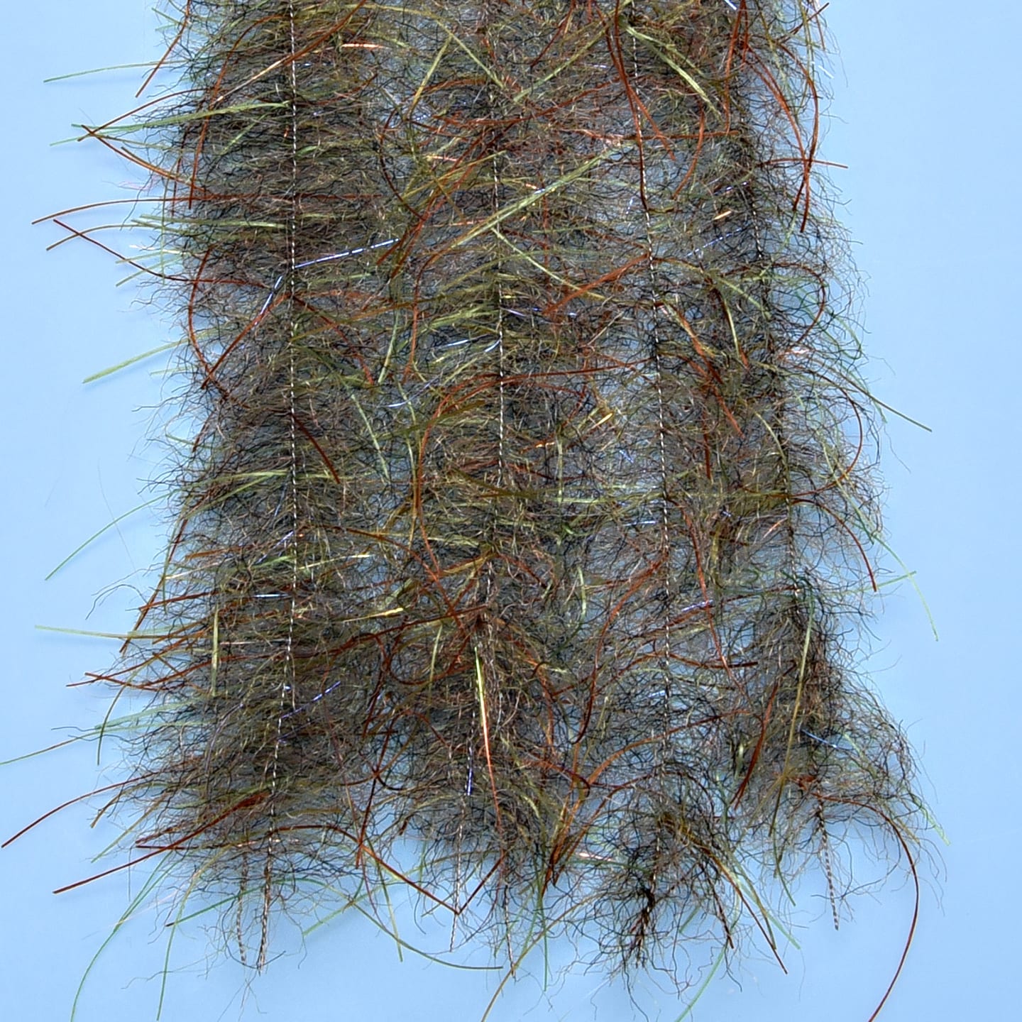 Olive-brown Enrico Puglisi Tarantula Hairy Legs brush with fuzzy synthetic hair and orange, metallic strands for fly tying
