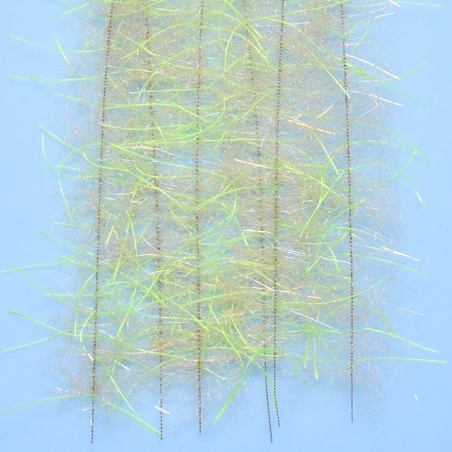 Chartreuse and tan synthetic hairy-legs brush with iridescent flash fibers and thin black leg threads for fly tying