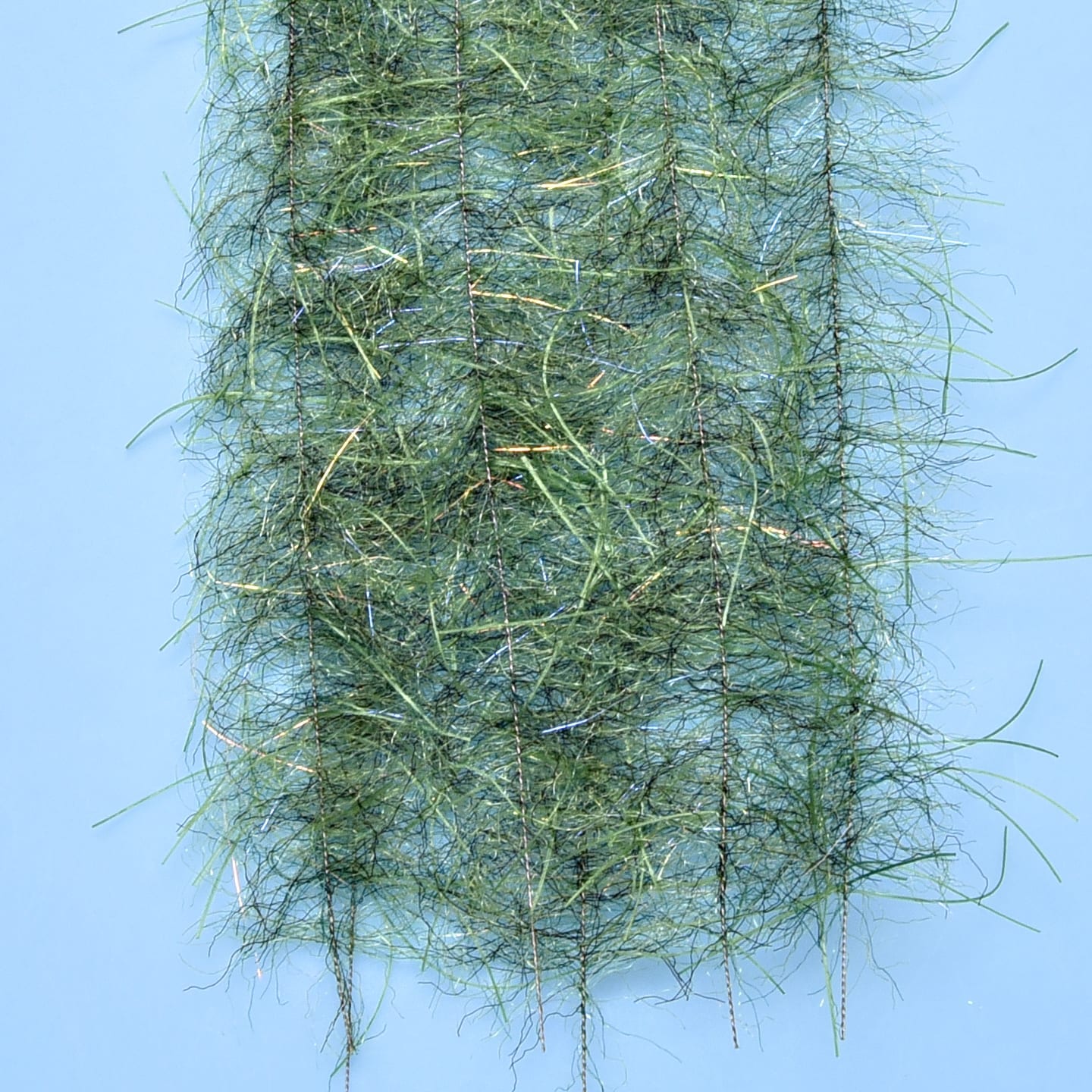 Olive green Enrico Puglisi tarantula hairy-legs brush with wispy synthetic fibers and gold/silver flash for fly tying