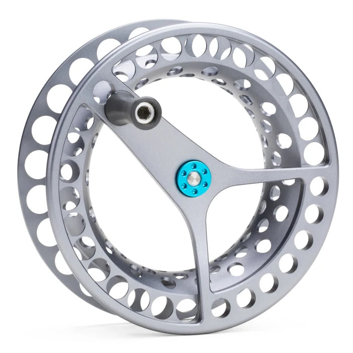 Silver machined-aluminum Lamson Force SL II spare spool with teal center screw, large vented ports and three-arm arbor