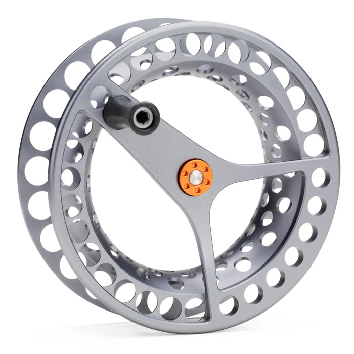 Lamson spare spool: machined silver aluminum reel with large circular cutouts, three-arm frame and orange hub accent