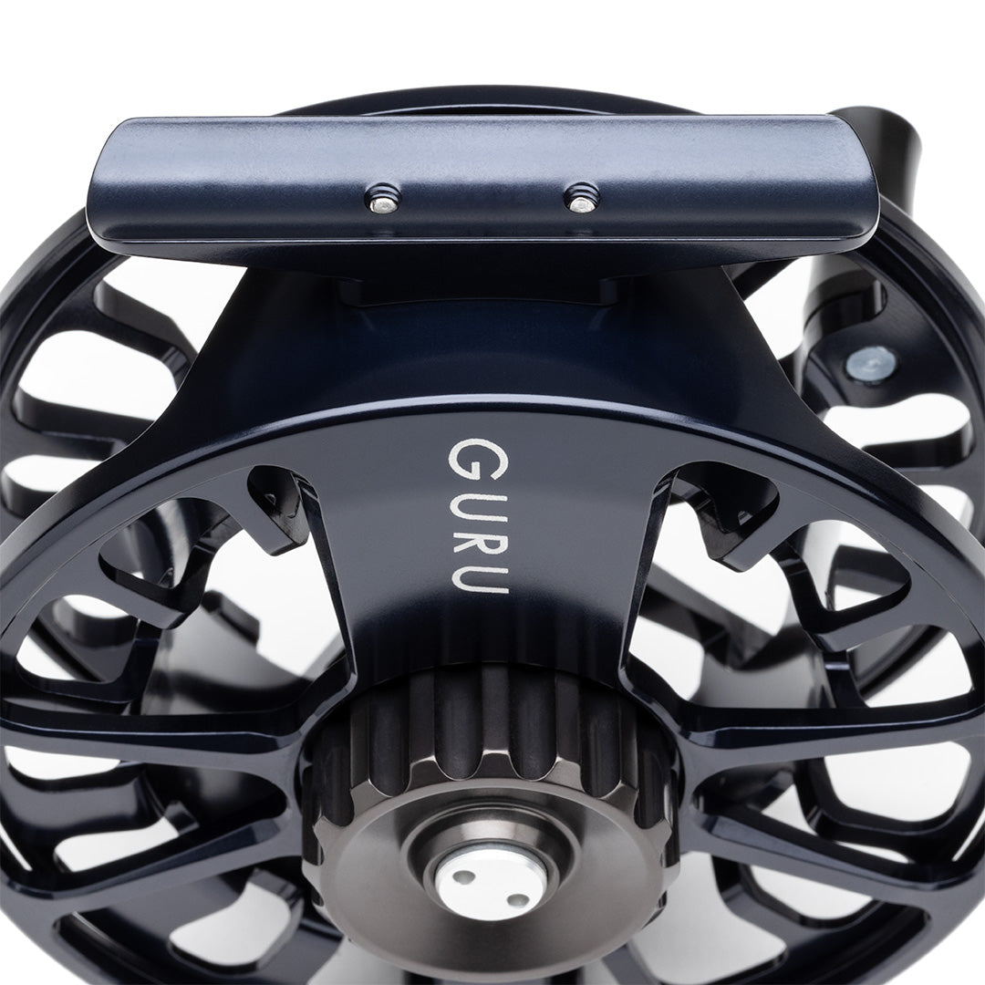 Lamson Guru X black fly reel with large arbor design, featuring precision machining and sealed drag system for freshwater