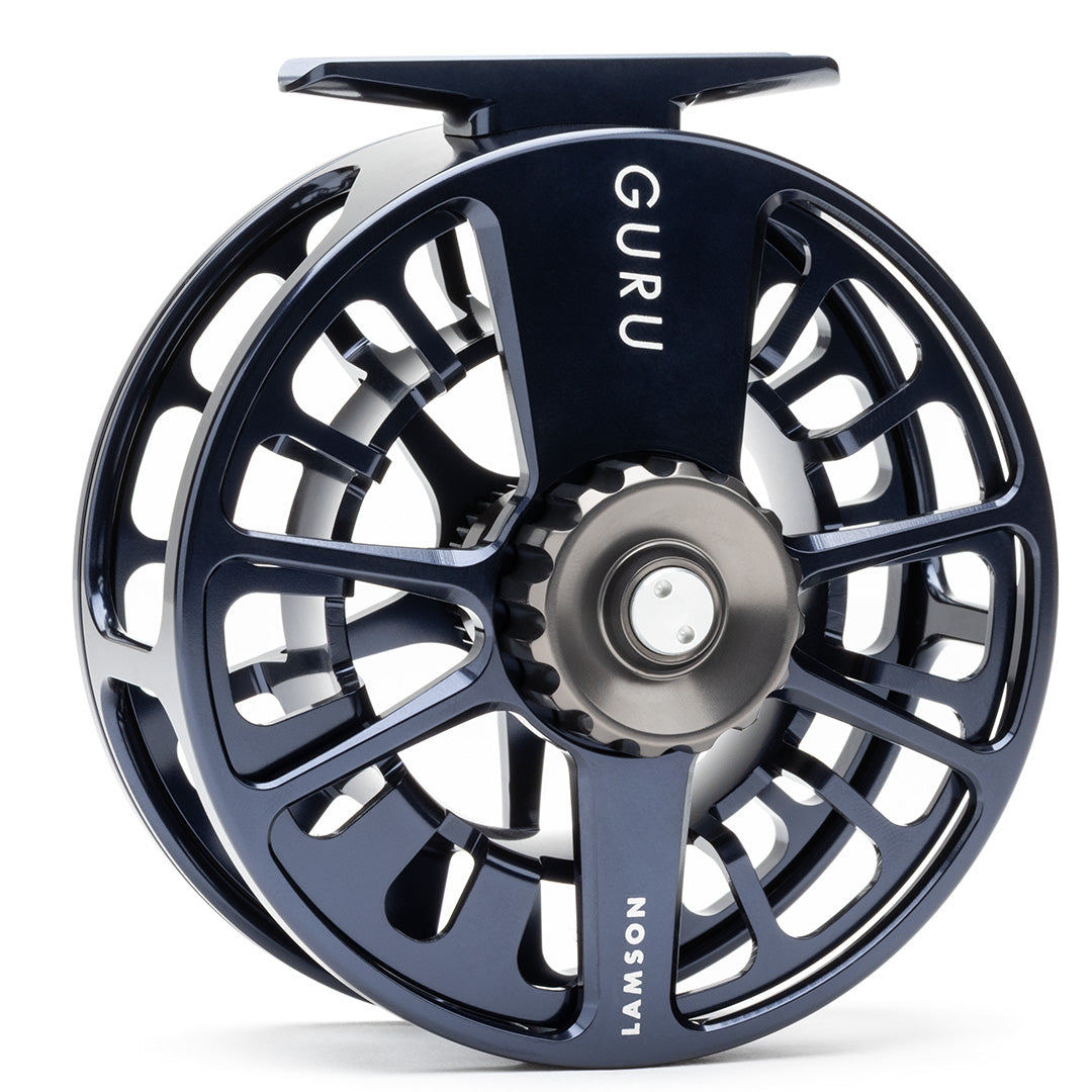 Lamson Guru X HD fly reel in midnight blue with large arbor design and exposed drag wheel for saltwater fishing