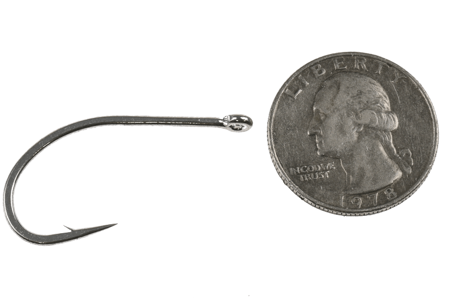 Gamakatsu SC15 Wide Gap Hook next to quarter for size comparison, showing black curved fishing hook design