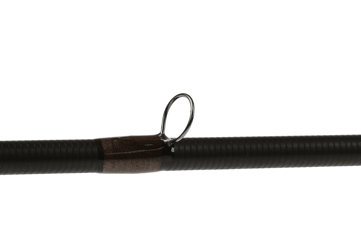 Greys Stream-Flex fly rod detail showing black cork grip with brown wrapping and chrome guide ring against white background
