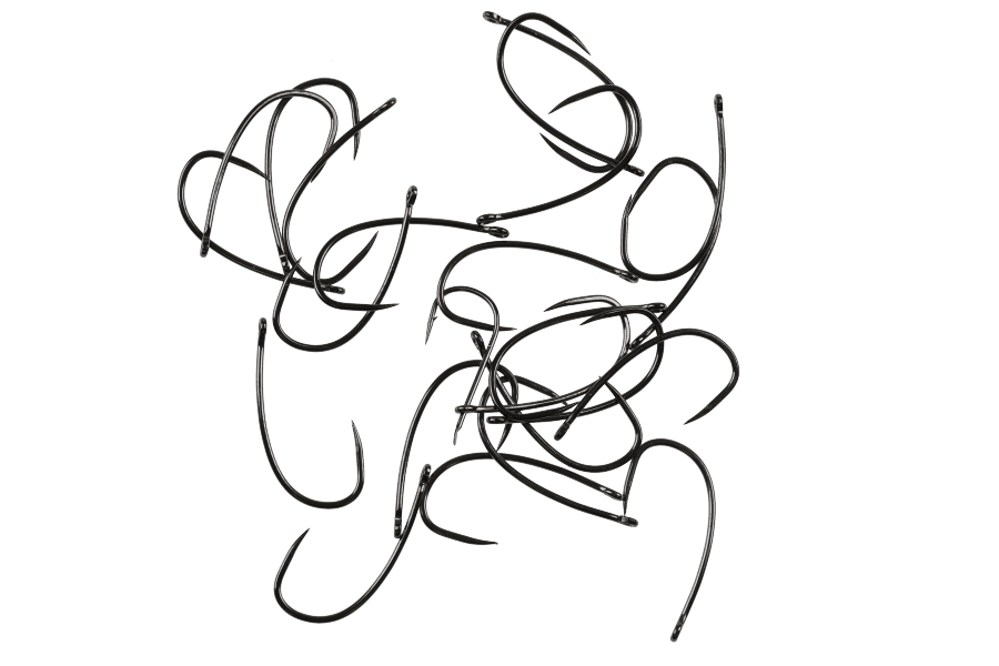 Black Hanak 530BL fishing hooks scattered on white background, showing curved shanks, sharp points, and eyes for fly tying