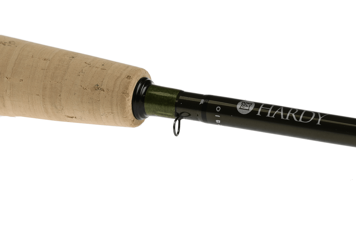 Hardy Aydon fly rod with natural cork handle and dark olive blank, angled view against white background