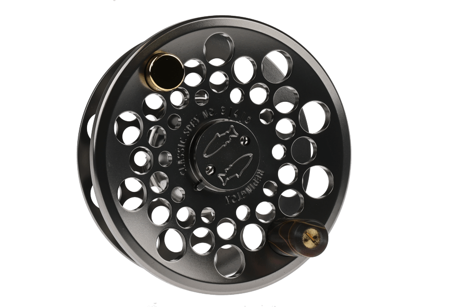 Black Redington Classic Spey fly reel spare spool with large cutout holes, gold-accented knob and etched fish logo.