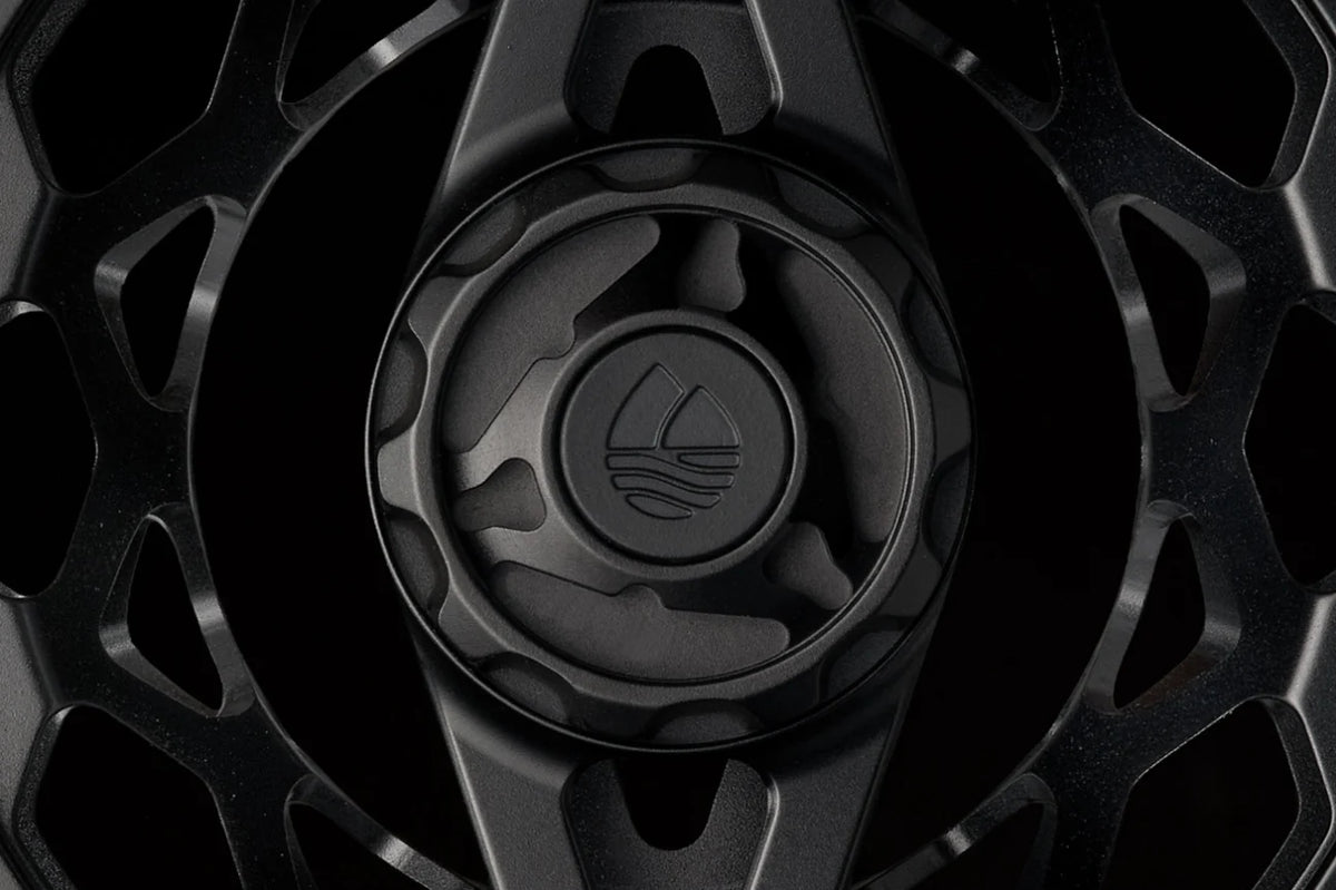 Black Redington Ace Tactical Edition fly reel with detailed machined finish and water logo, overhead view