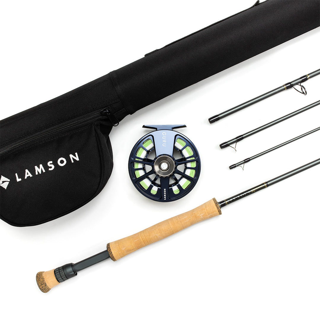 Lamson Speedster fly fishing rod outfit with cork handle, navy reel with lime accents, and black carrying case on white