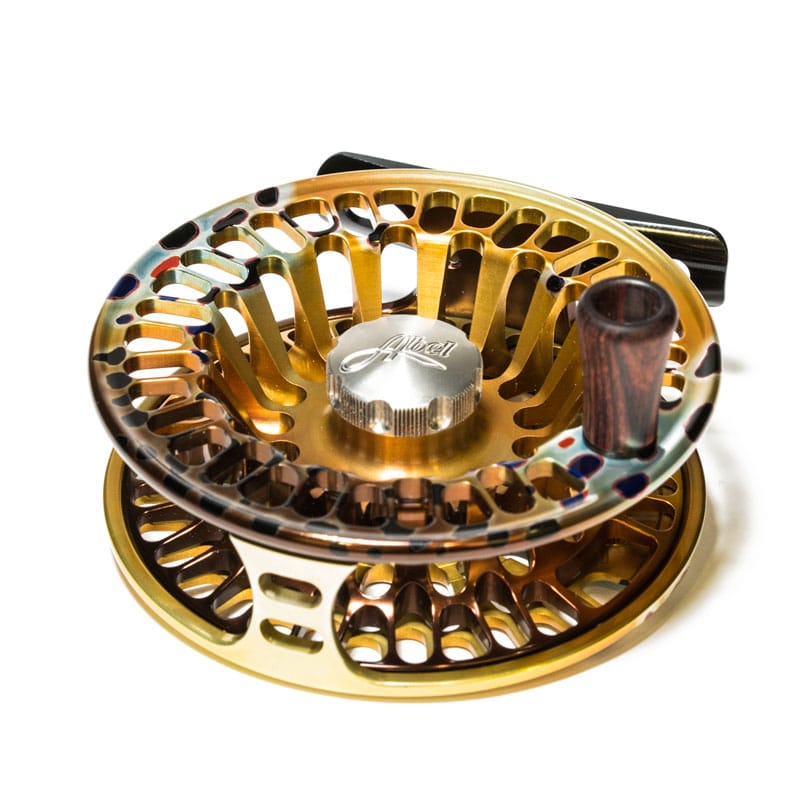 Abel TR fly reel in gold-anodized aluminum with vented spool, bronze rainbow accents and wooden handle