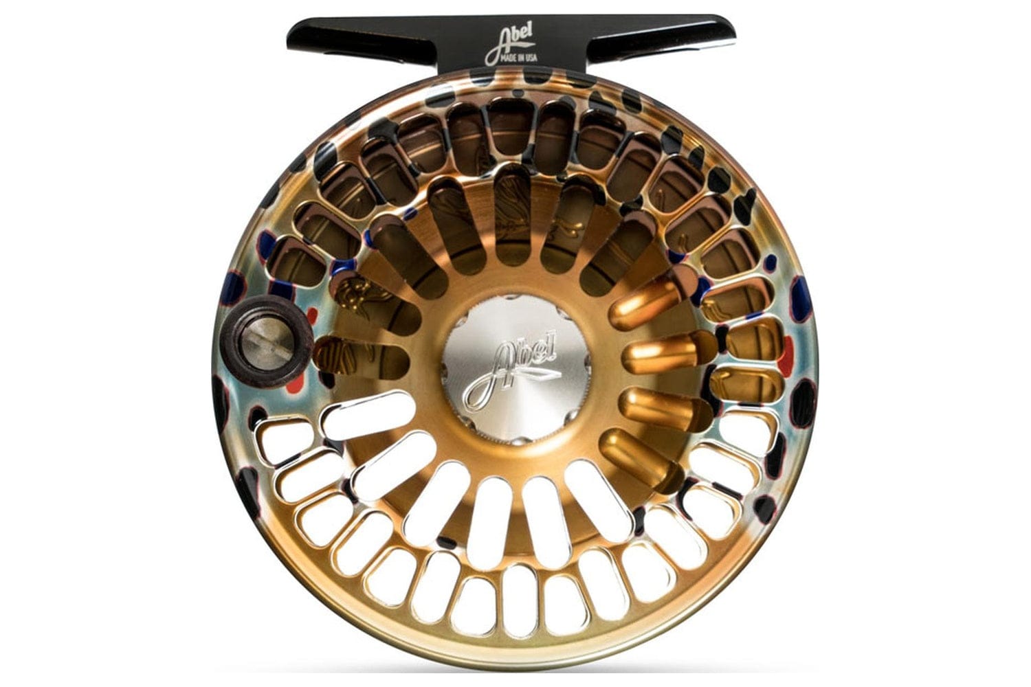 Abel TR in a brown trout graphic finish — gold anodized ports, blue-haloed spots, and milled insect silhouettes inside the frame