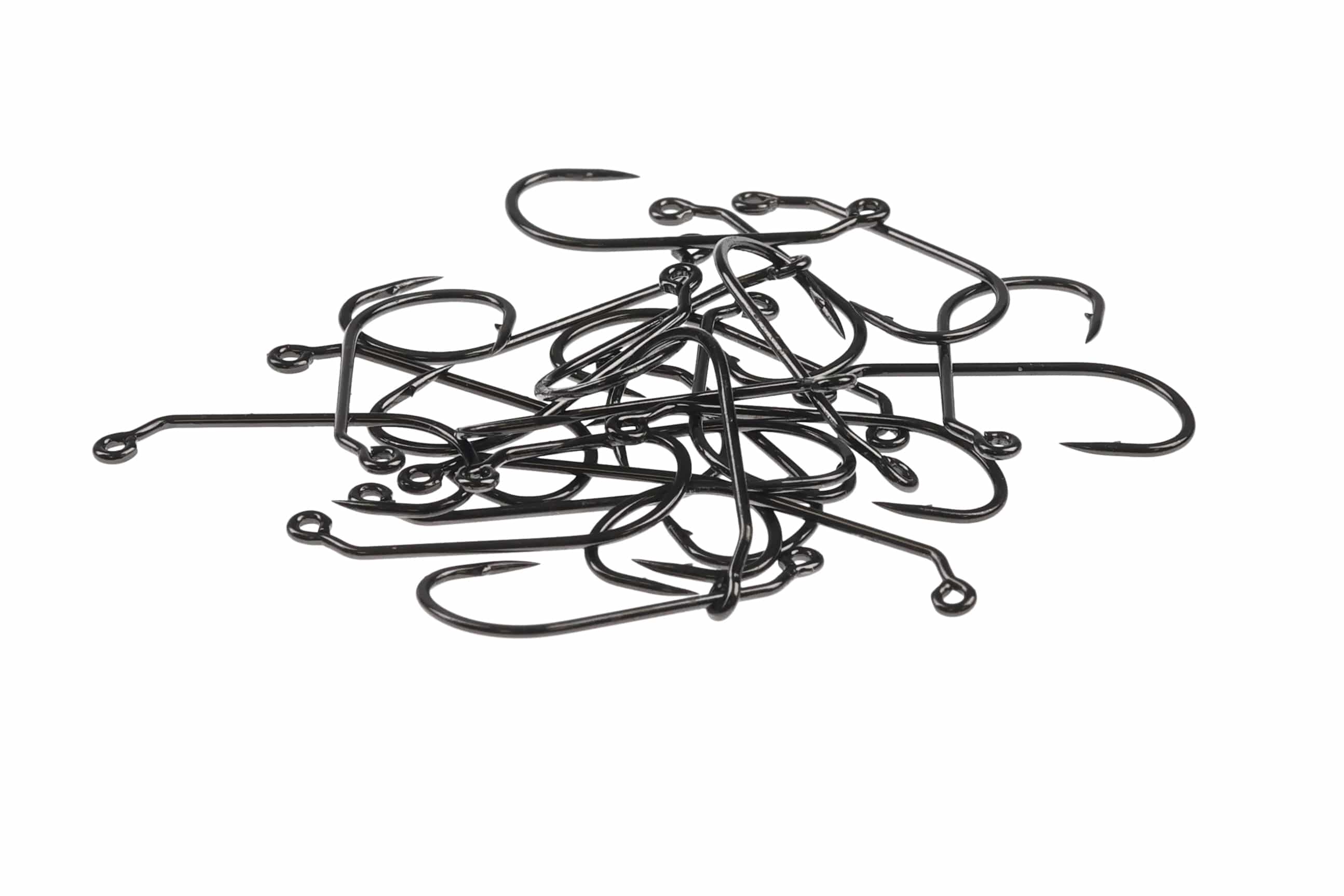 Pile of glossy black metal Ahrex mini jig hooks with small eyes, barbed points and curved jig shanks for fly tying