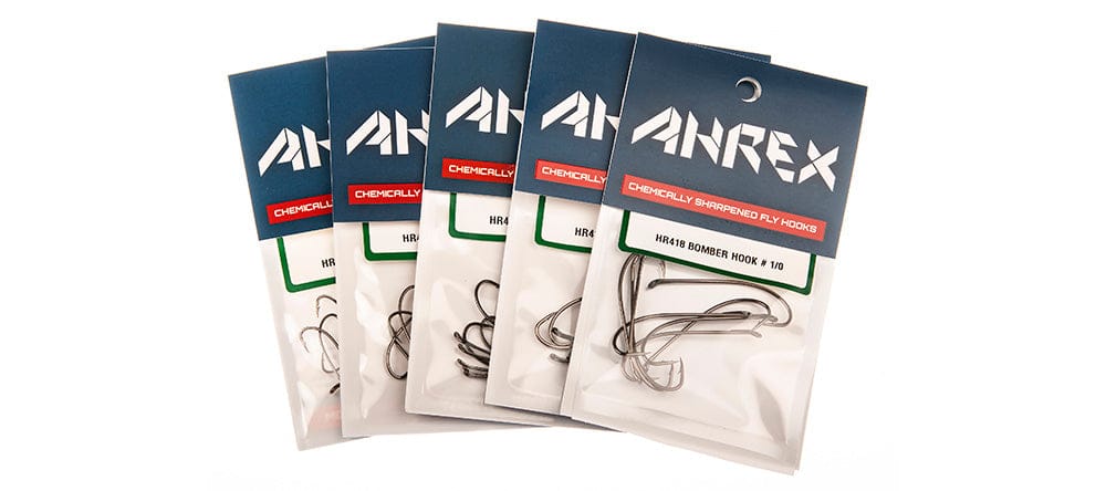 Five Ahrex AHR418 Bomber Hooks packs fanned, shiny nickel bomber hooks in clear plastic with blue branded header, fly tying