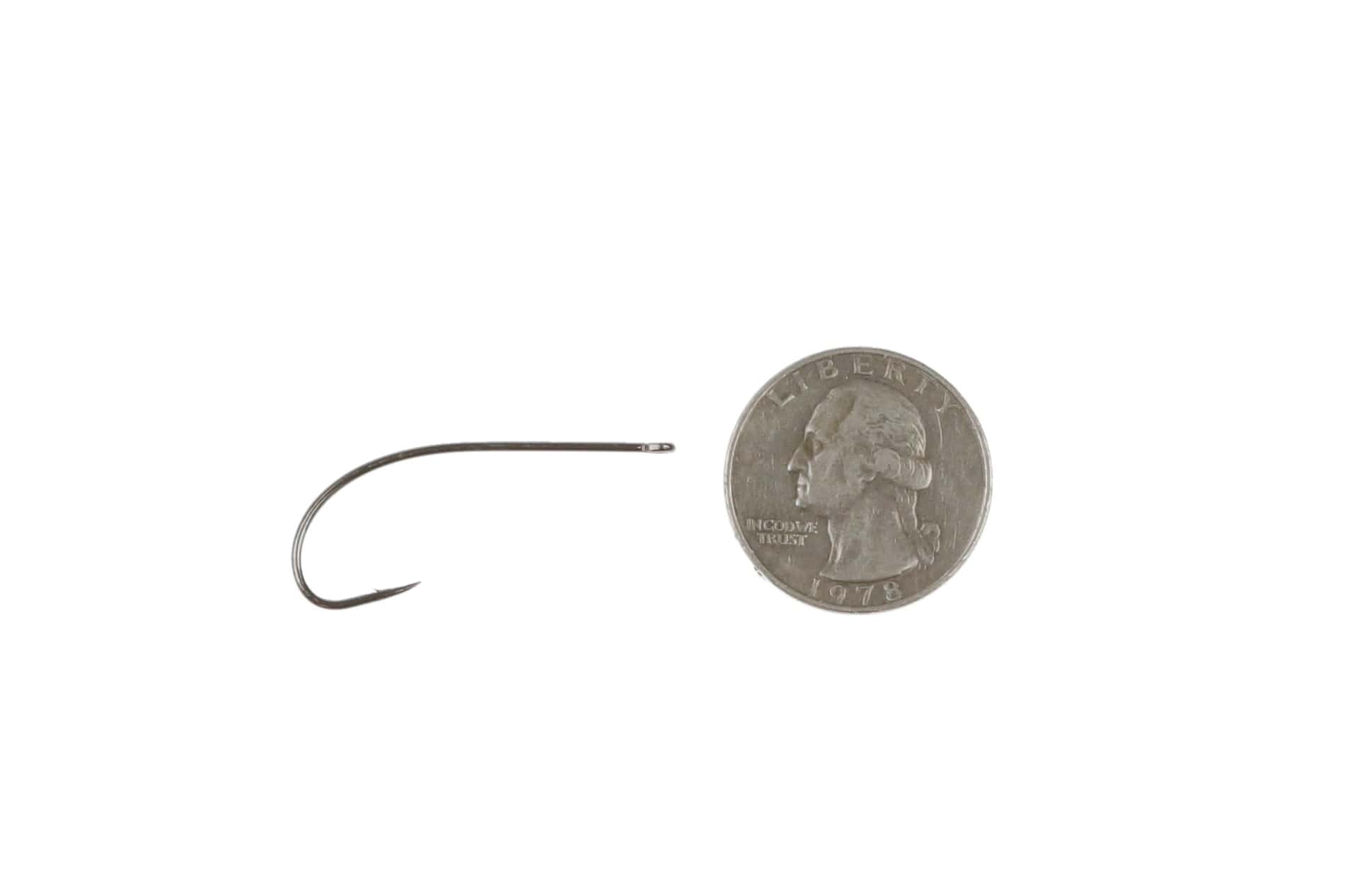 Ahrex long shank dry fly hook in gunmetal steel with slim straight eye and fine point beside a US quarter for scale
