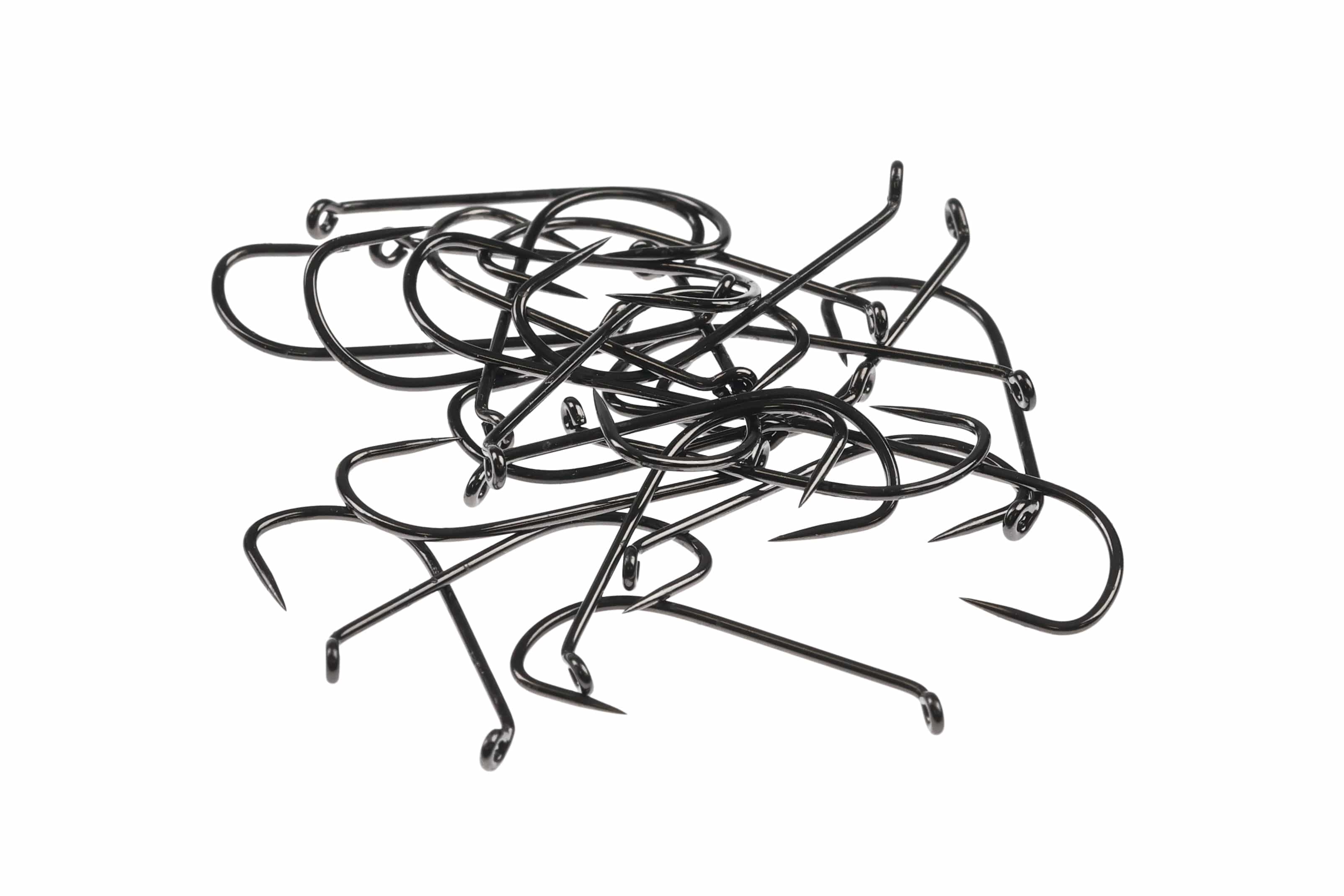 Pile of glossy black barbless long-shank Ahrex dry fly hooks with turned-down eyes and sharp points for fly tying