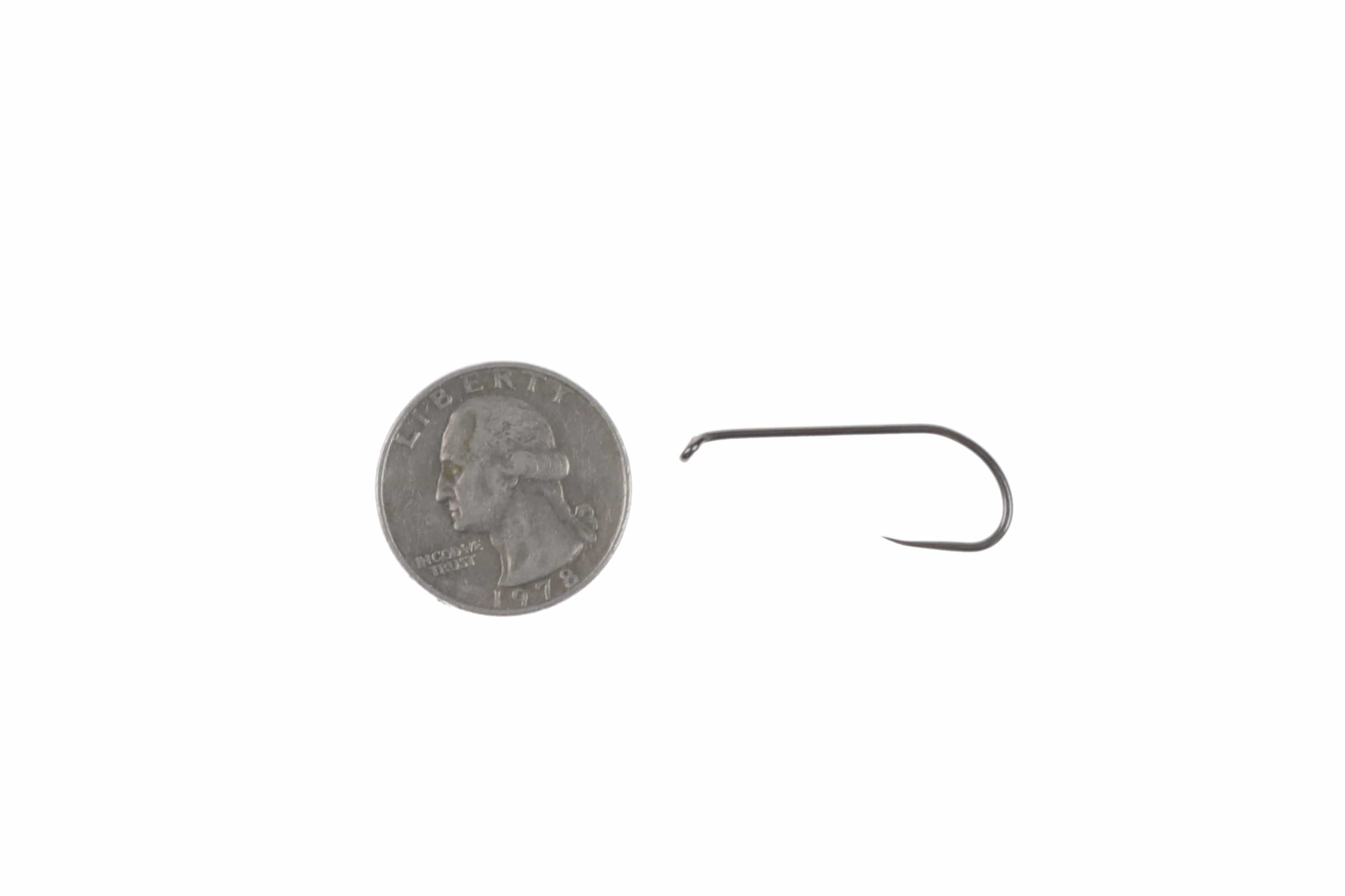 Ahrex NS105 gunmetal down-eye streamer barbless hook with fine point beside US quarter for scale