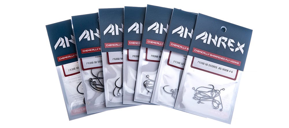 Seven Ahrex PR360 50° jig hooks packs showing matte gunmetal steel hooks in blue branded packaging, for fly tying
