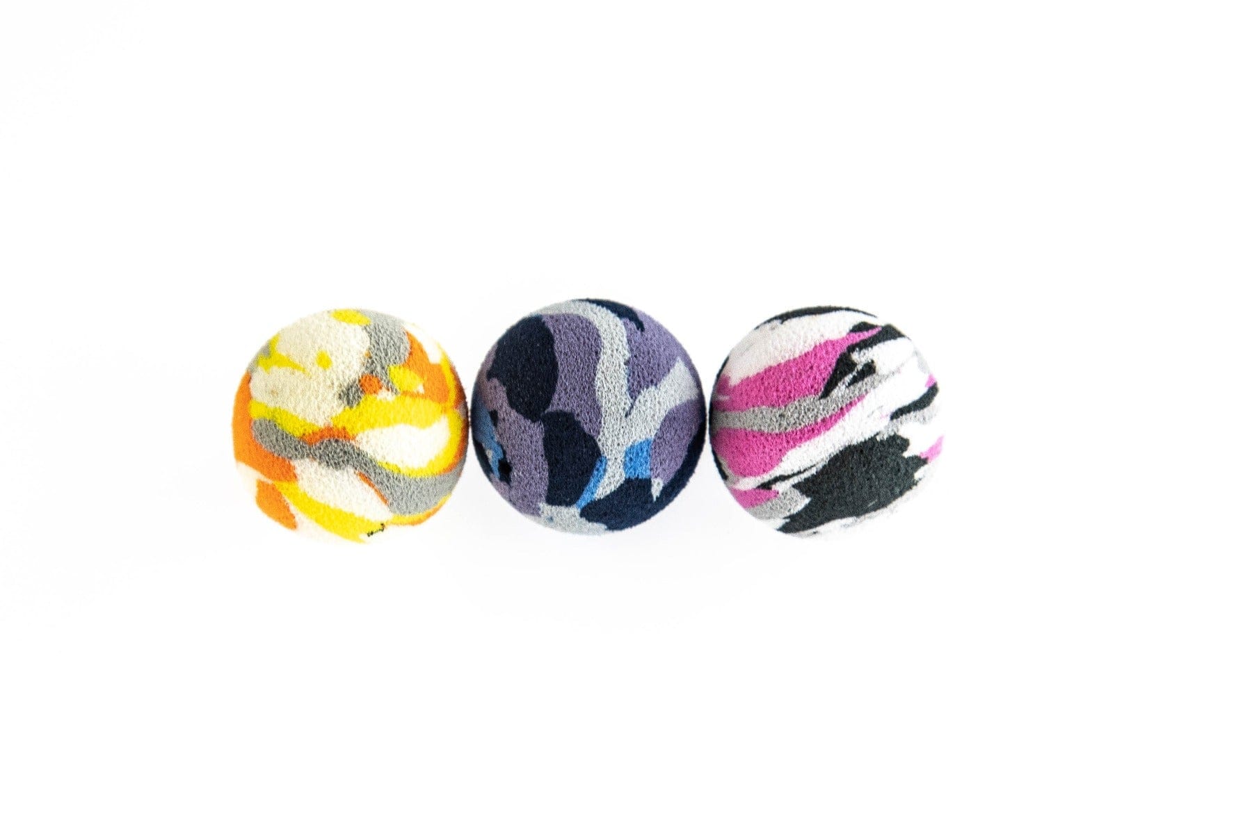 Three Airlock strike indicator foam balls in yellow/orange, purple/blue and pink/black camo patterns, round fishing accessory