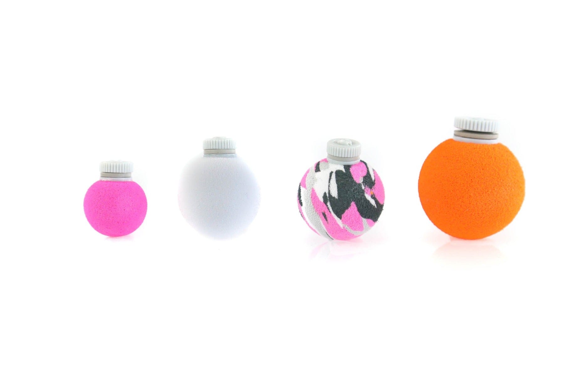 Four foam fishing strike indicators with white plastic screw caps, small pink, white, pink-black camo and orange foam spheres