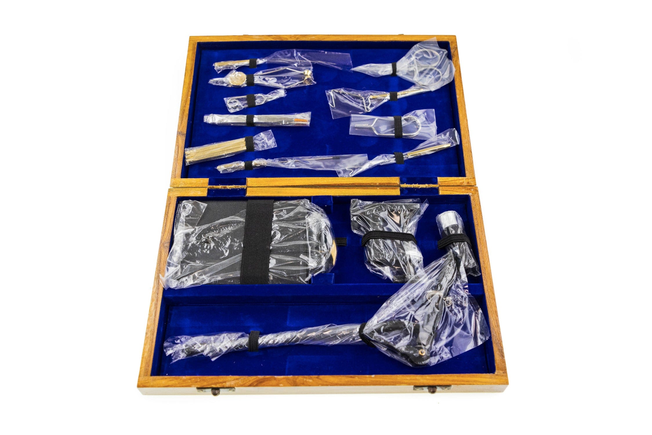 Angler Haus wooden fly tying kit in hinged wood case with royal blue velvet interior, wrapped metal tools and vise