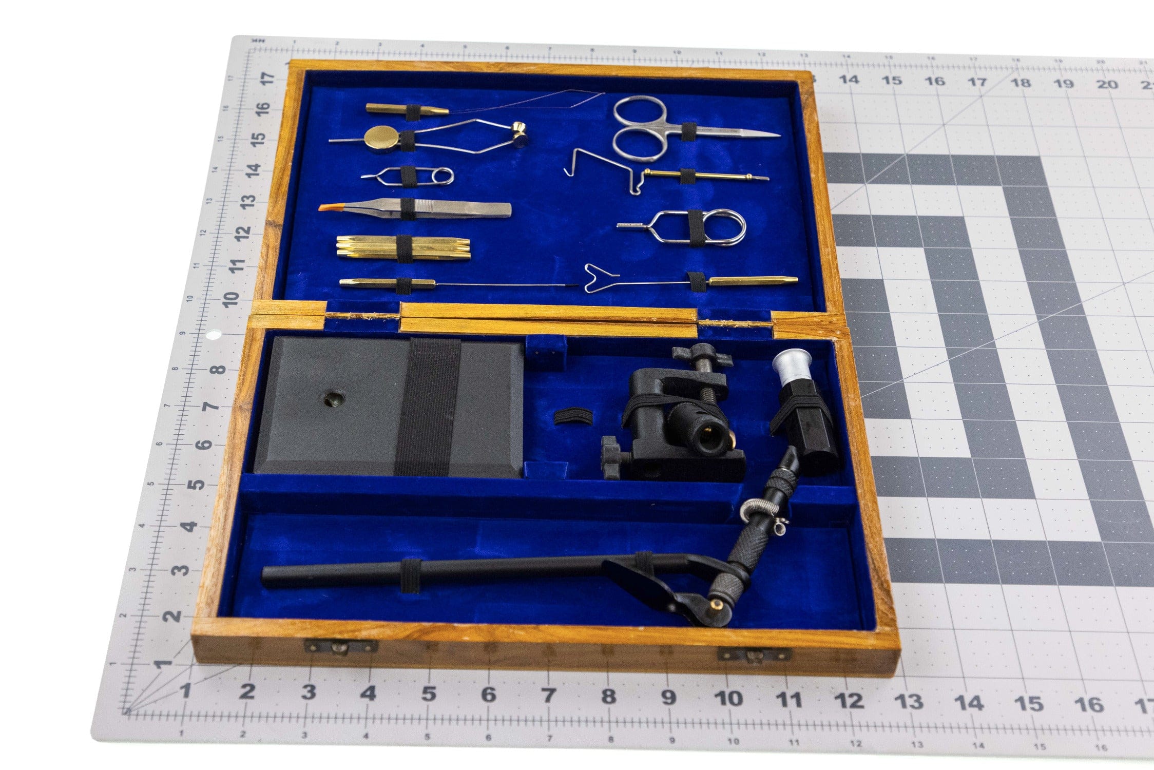 Angler Haus deluxe wooden fly tying kit with blue velvet interior, brass and steel tools and black vise in oak case