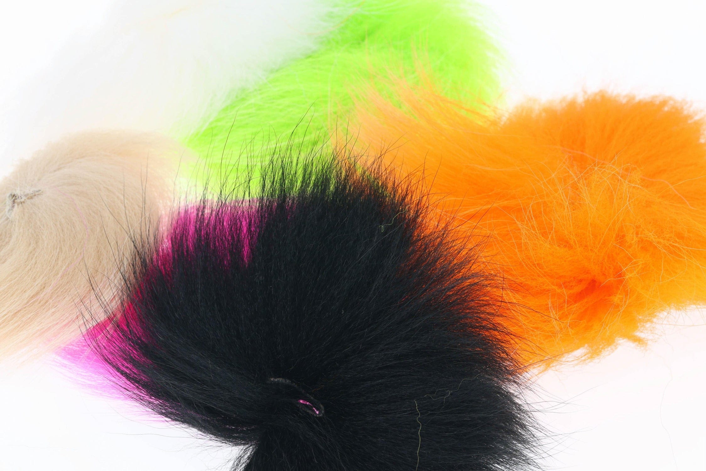 Dyed blue fox fur patches in black, orange, neon green, pink and tan, fluffy material for fly tying