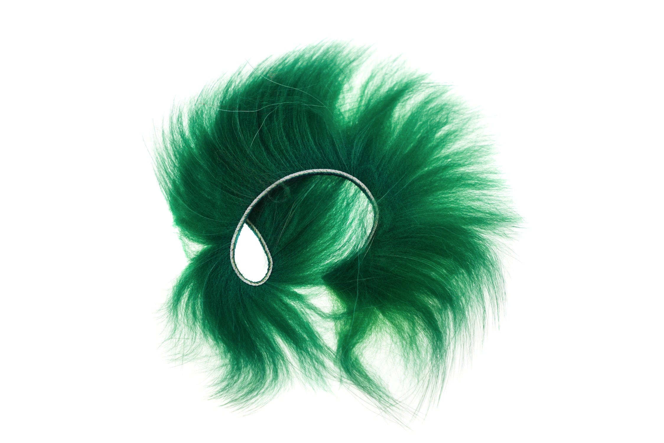 Deep green raccoon fur zonker strip with long fluffy fibers and stitched backing for fly tying