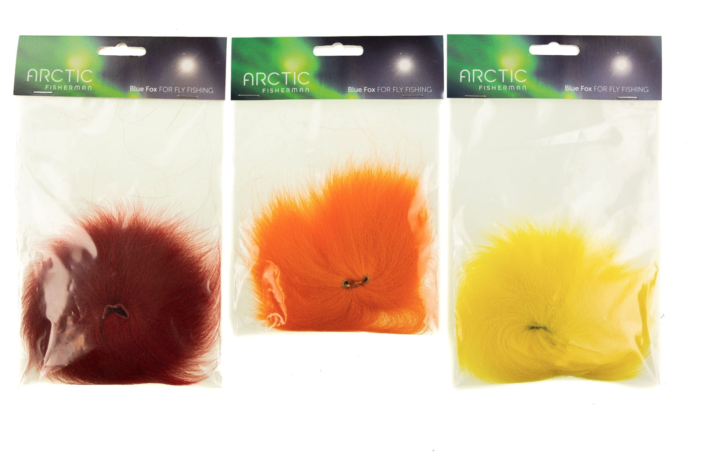 Arctic Fisherman fox hair packs for fly tying, soft mutation fur in burgundy, bright orange, and vivid yellow.